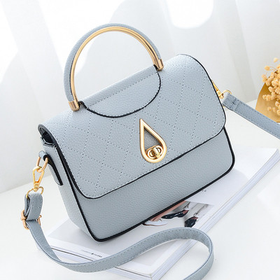 Καθημερινή συμπαγής τσάντα για γυναίκες με μη συνηθισμένη πόρπη και μακρά λαβή