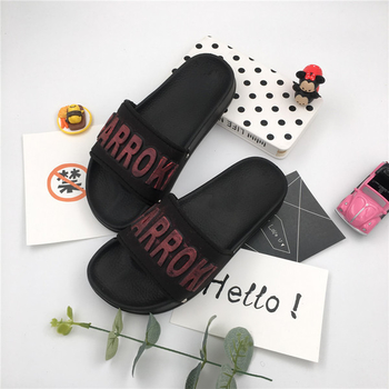 Красиви и модерни гумени чехли за дамите в черен цвят, с цветен надпис