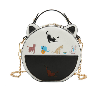 Лятна дамска чанта в кръгла форма с ушички с метална дръжка в два цвята
