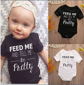 Παιδικό ολόσωμο σε λευκό και μαύρο χρώμα με επιγραφή