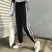 Μοντέρνα γυναικεία παντελόνια σε μαύρο χρώμα με λευκές λωρίδες