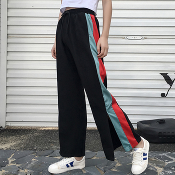 Спортно-елегантен дамски панталон - разкроен с цветни ленти