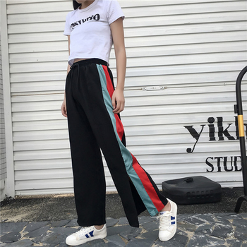 Спортно-елегантен дамски панталон - разкроен с цветни ленти